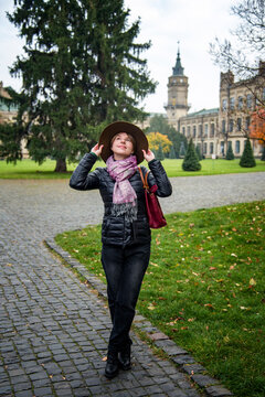 beautiful woman in vintage romantic walking in the castle autumn park in kyiv