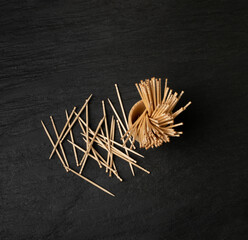 Wooden Toothpicks on Black Background with Copy Space, Flat Lay Tooth Picks, Wood Toothpicks Top View Mockup