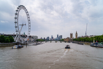London skyline view with famous landmarks, Big Ben, Houses of Parliament and ships on River Thames...