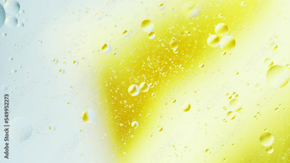 Aufkleber real close up oil bubbles in water rotation with color gradient abstract mixing background.