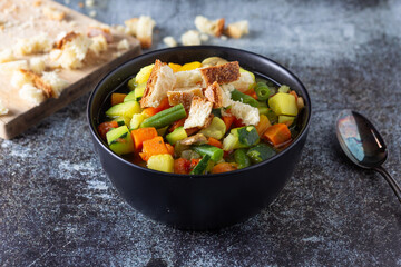 Minestrone with mixed vegetables with croutons. Healthy and nutritious dish, ideal for lunch or dinner and completely plant based. Vegetables soup.