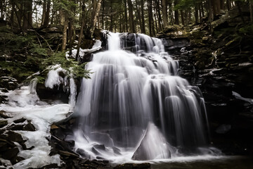 water cascades over the falls at this waterfall from Ricketts Glen, Pennsylvania