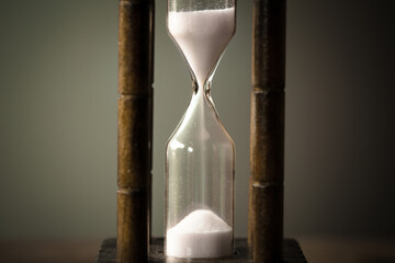 vintage tone of hourglass. passing time in a countdown sandglass with copy space for add text.