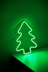 Green Christmas tree neon sign on background. Trendy style. Neon concept. Modern style. Neon sign. Custom neon. Home decor.