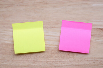 sticky note paper on wood table. for add text message.