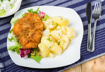 pork chop with potatoes and salads