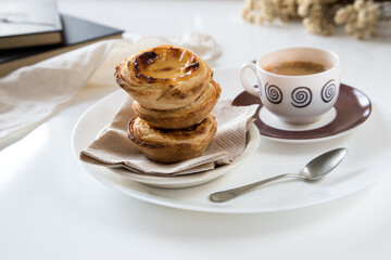 Pasteis de nata, traditional sweet of Portuguese cuisine. Small crunchy puff pastry pies and a...
