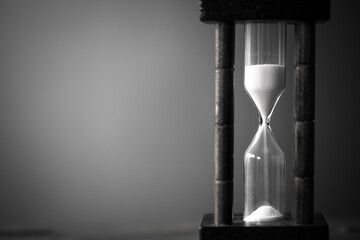 vintage tone of hourglass. passing time in a countdown sandglass with copy space for add text.