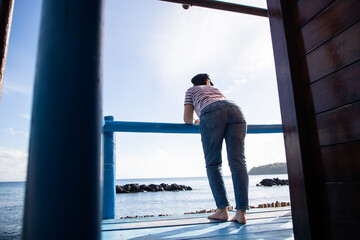 woman relaxing by the sea