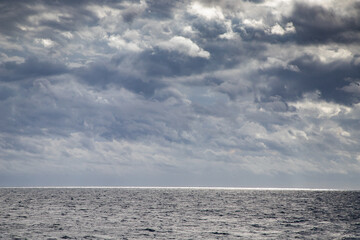 Obraz premium seascape with dark clouds and light