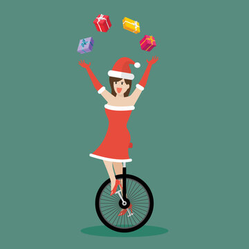 Santa girl juggling gift boxes on unicycle