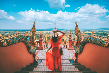 Traveler asian woman with dress travel in temple at Lampang Thailand - obrazy, fototapety, plakaty