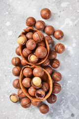 Macadamia nut. On a stone background. Top peregdyad. Free space for text.