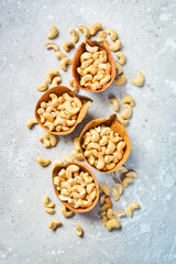 Cashew nut on a stone background. Roasted nuts. Assortment of nuts. Top view.