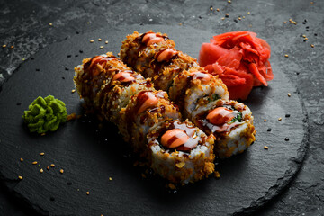 Traditional sushi rolls on a stone plate. Close-up. Sushi menu. Japanese food. © Yaruniv-Studio