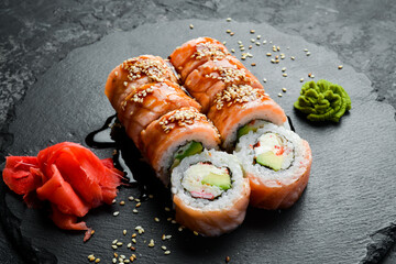 Sushi rolls on a stone plate. Close-up. Japanese food.