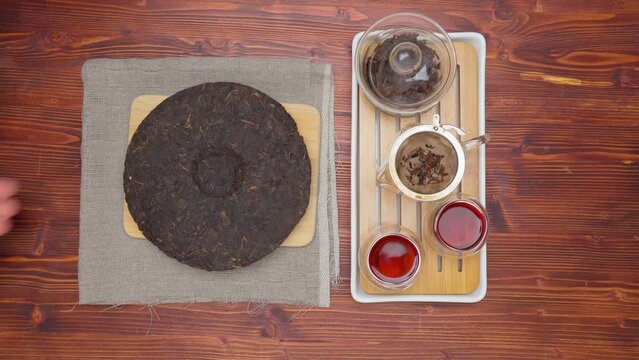 Chinese Tea Ceremony. Pu erh on wooden background. Selective focus. Top view. Autumn. Top view