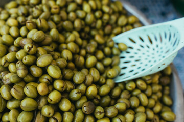 Green olives close up background.