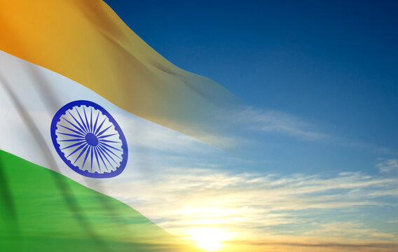 National flag of India on the sky with sunset or sunrise