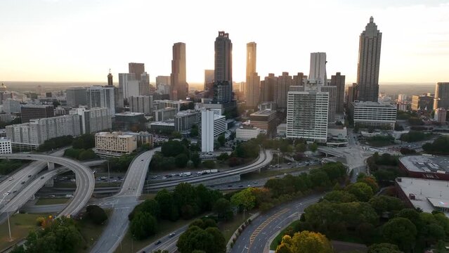 Atlanta Georgia skyline in evening light. Sunset behind skyscraper buildings. American urban life in USA theme.