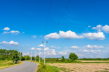 Fototapeta na wymiar view of asphalt roads countryside Beside with spring nature and tree green in fluffy clouds blue sky daylight background.