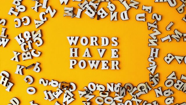 4k zoom in out Quote WORDS HAVE POWER made out of wooden letters on bright yellow background. Motivational Words Quotes Concept