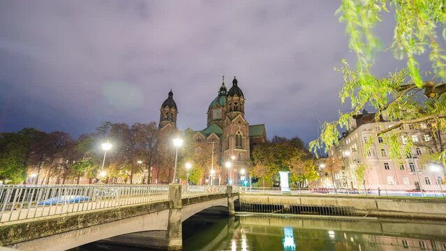 Sunset day to night Hyperlapse Isar river and St Lukas Church, Munich, Germany
