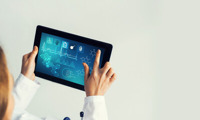 Close of female doctor hands working with tablet pc computer