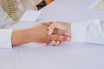 close up of a senior person holding their hands