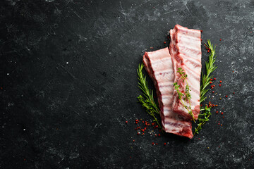 Meat. Raw Pork ribs with rosemary. Top view. Rustic style. © Yaruniv-Studio
