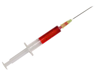 
A 2ml syringe with orange medicine an a needle ready for injection isolated on a transparent background