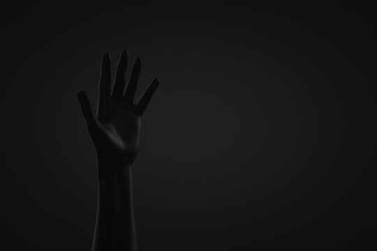 Dark hand raised. Dark background