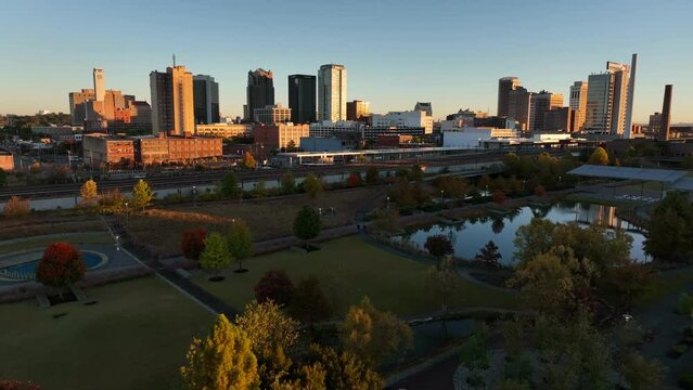 Birmingham Alabama skyline at dawn. Golden hour light features downtown city. Aerial view.