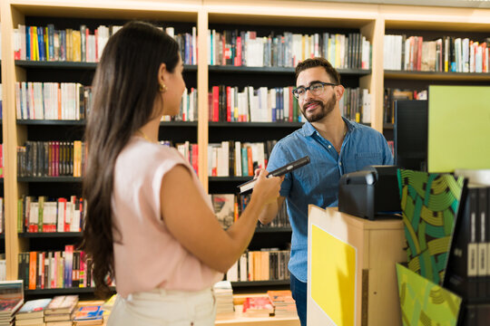 Customer asking for a book recommendation to a happy worker
