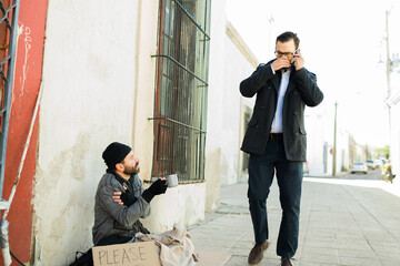 Dirty smelly homeless man begging for money