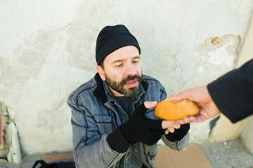 Hungry homeless man begging for food