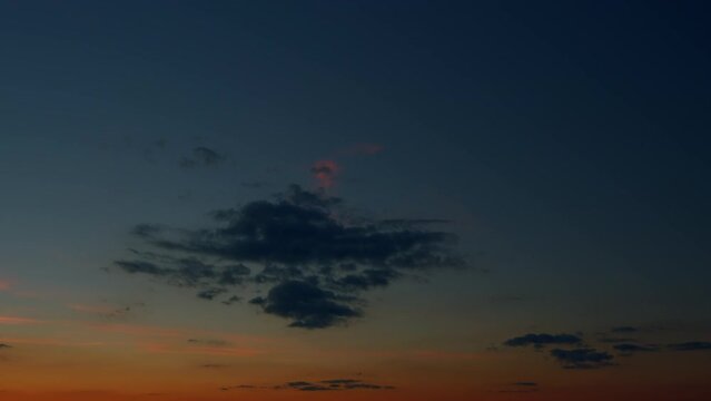 Beautiful sunset. Evening sky scene with different shades light from the setting sun. Timelapse.