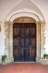 Wooden door of the Shrine Of the Beato Sante near Monbaroccio, a little fortified village in the...