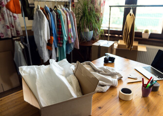 Obraz na płótnie Canvas Desk of garage sale of pre owned clothes or donation.