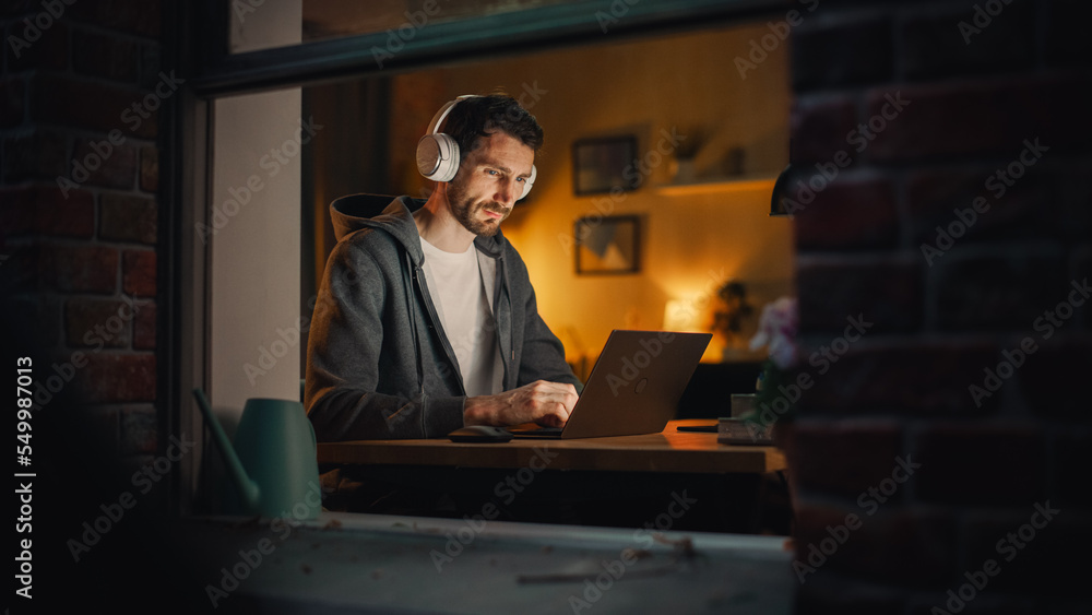 Poster Professional Software Engineer Working From Home Office. Tired IT Specialist Feeling Sleepy and Finising Important Project. Application Development Process. View From Outdoors into Window.