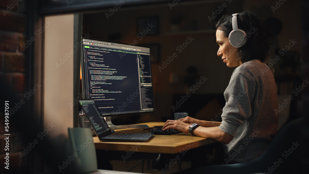 Aufkleber Brazilian Female Programmer Working on Computer at Home. Brilliant Female IT Programer Using Desktop Computer Late Night. Professional Developer Programming Code. Shot Into the Window From Outside.