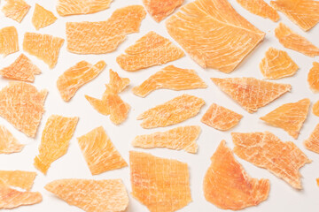 Group of tasty beer snacks. Dehydrated chicken meat slices.
