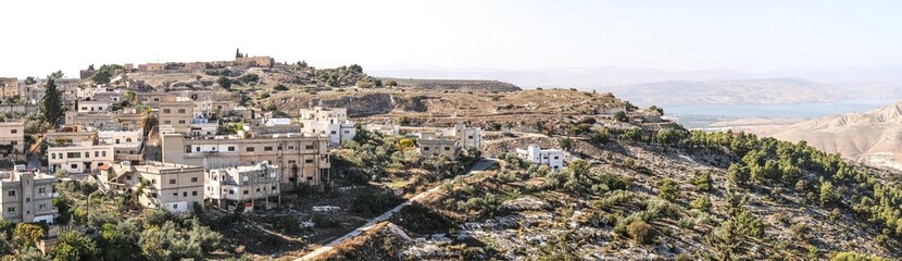 Fototapeta premium Om qais fort and lake - vellege om qaise- Jordan- ام قيس والقرية