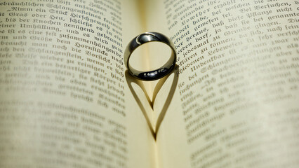 wedding rings on book
