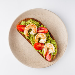 delicious Italian bruschetta with shrimps on a white background