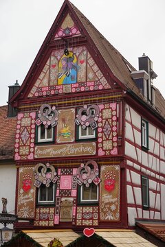Vertical of a Christmas market in Bad Wimpfen Christmas house with pink decorations