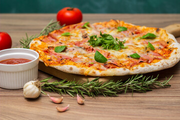 Italian pizza Capricciosa  with cheese, tomato sauce and basil