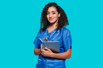 Horizontal medium studio portrait of smiling african medical female worker wearing blue uniform...