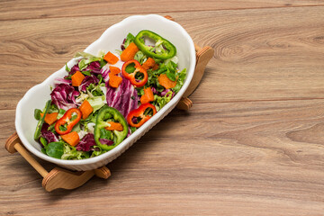 Bowl of freshly salad with pumpkin