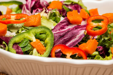 Bowl of freshly salad with pumpkin